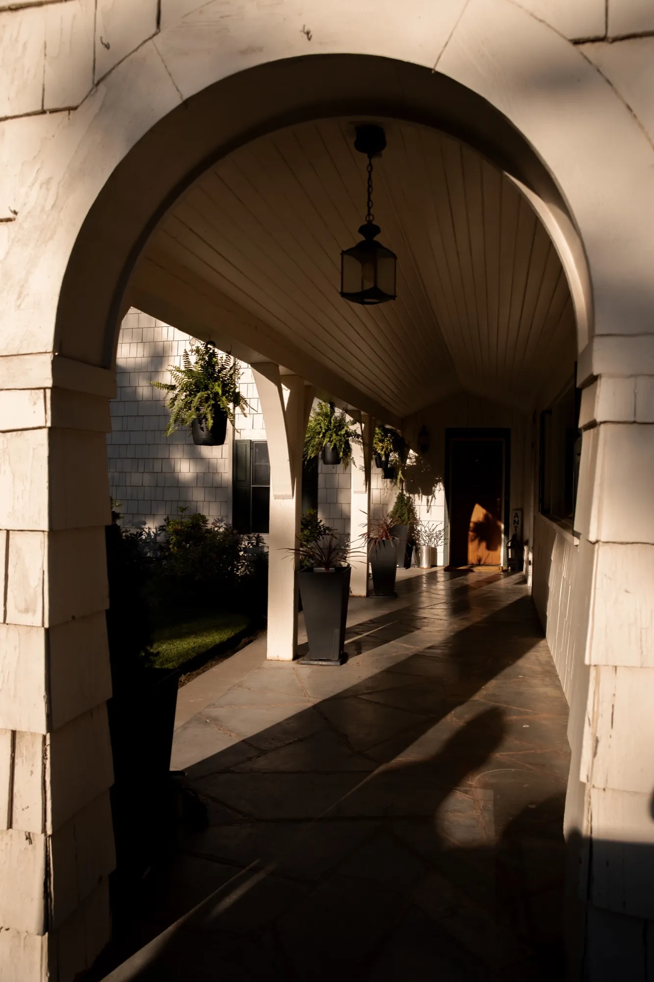 Stone-flagged porch through the arch
